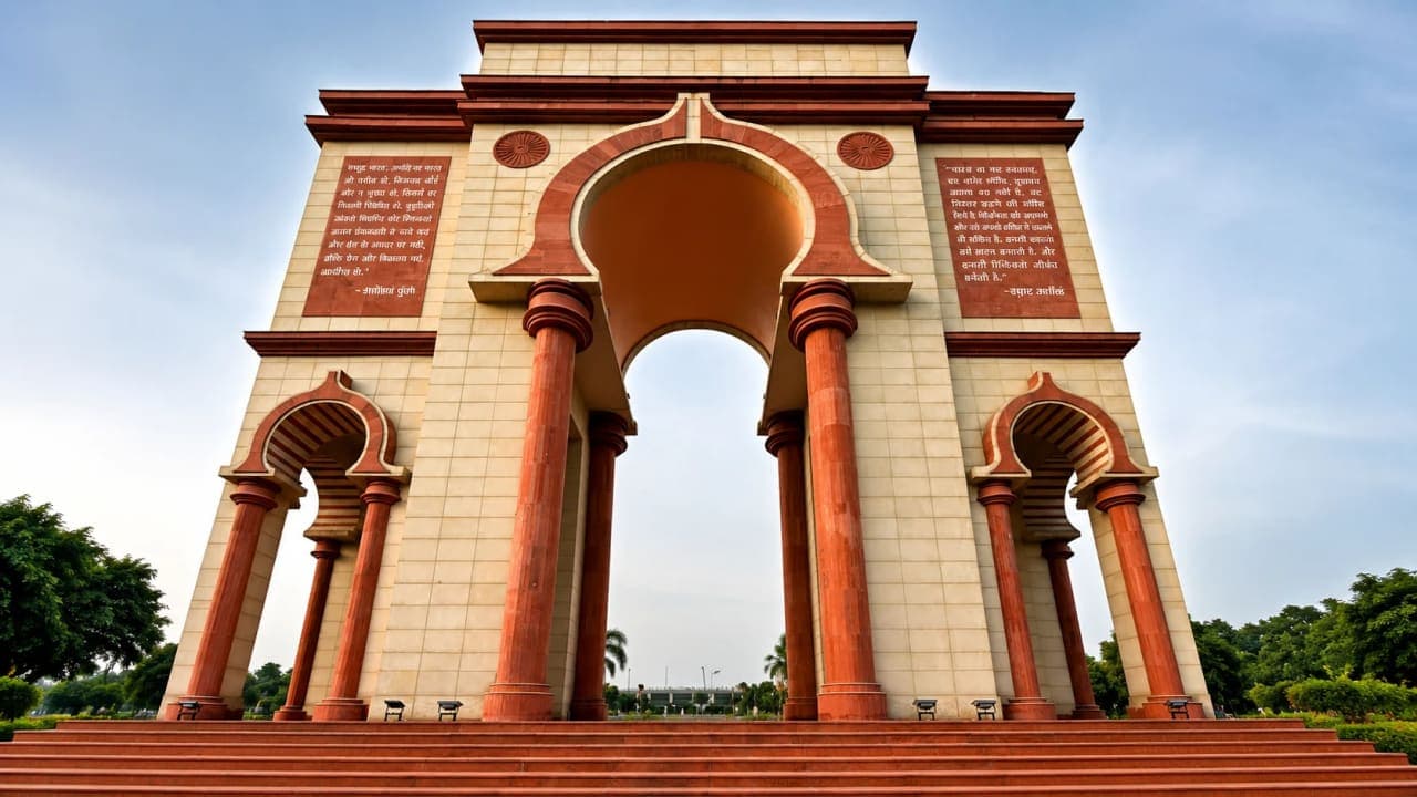 Low-angle view of Sabhyata Dwar in Patna with its grand arches and red sandstone pillars.