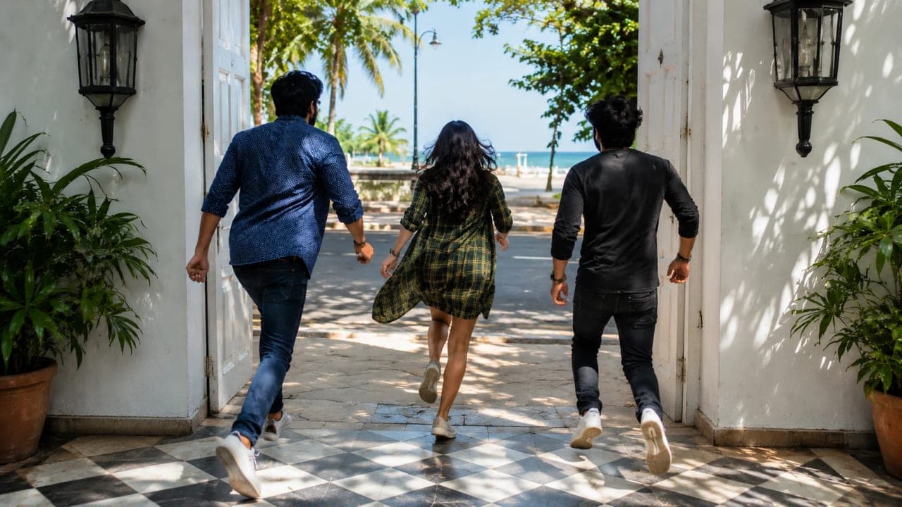 Friends hurrying out of a hotel in Pondicherry after oversleeping.