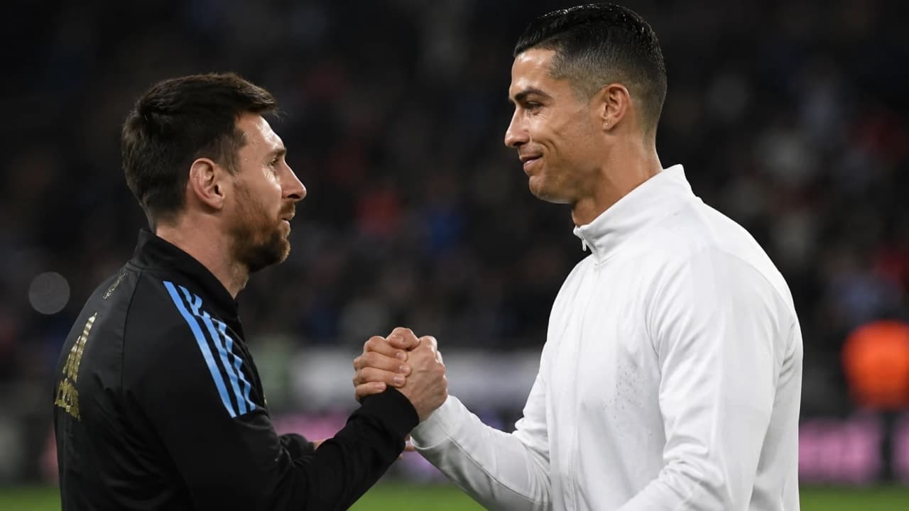 Lionel Messi and Cristiano Ronaldo greet each other before a football match.