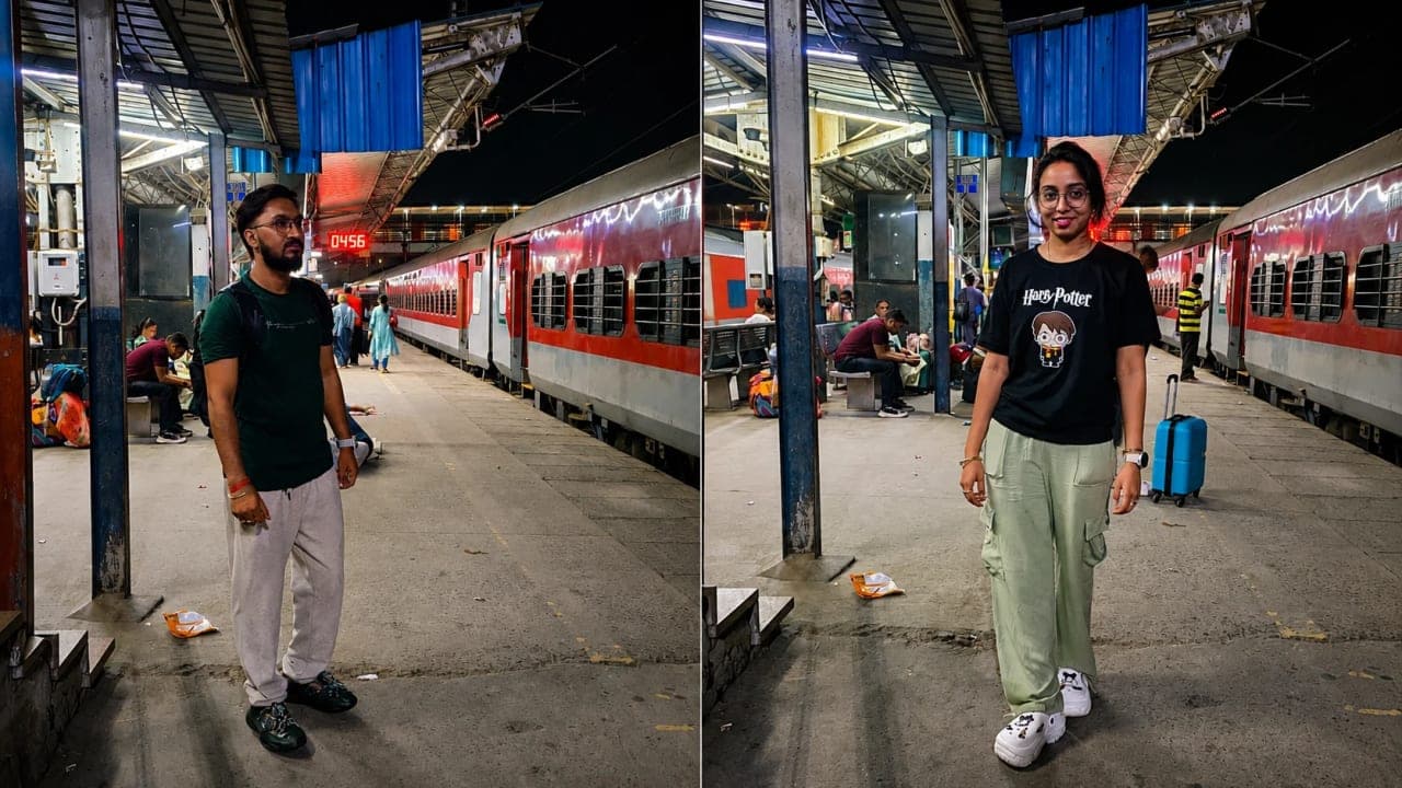 My husband and I waiting at the railway station before boarding our early morning train to Kerala.