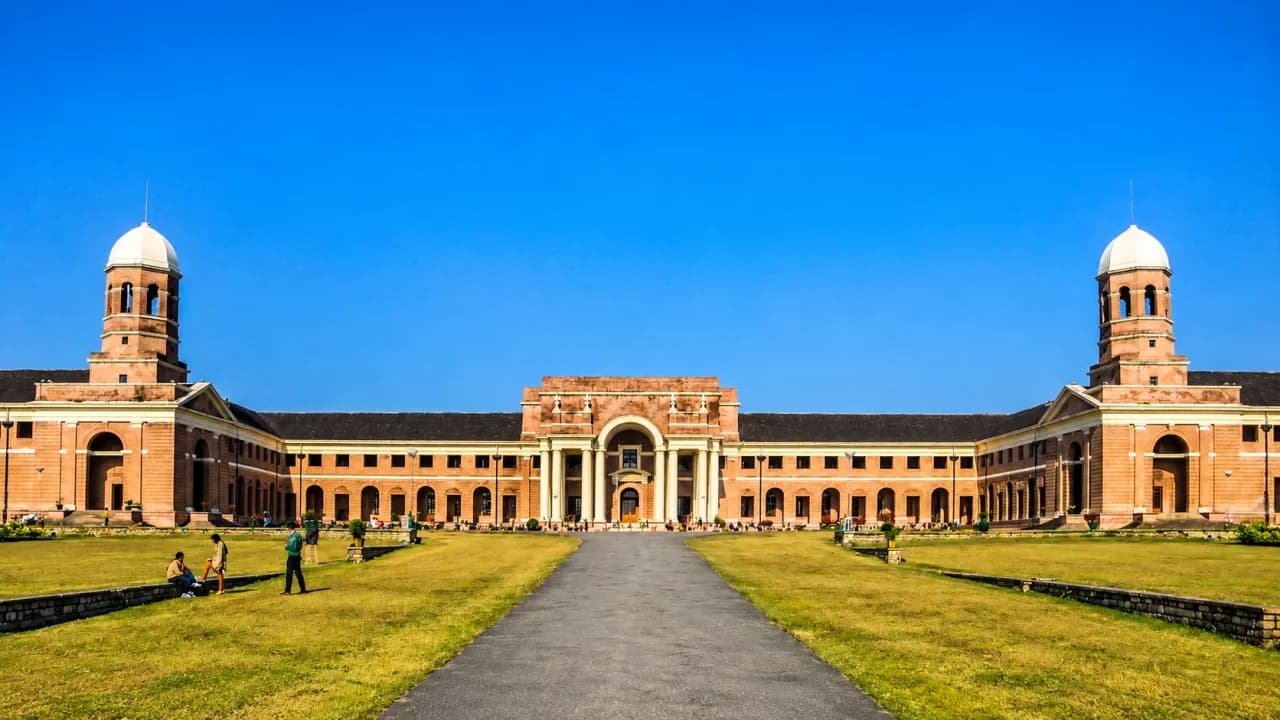 Historic Forest Research Institute FRI Dehradun building with grand columns, domed towers and green lawns